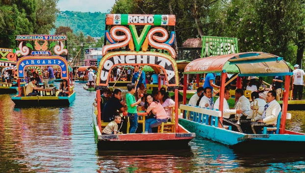 Sailing in trajineras through the canals of Xochimilco
