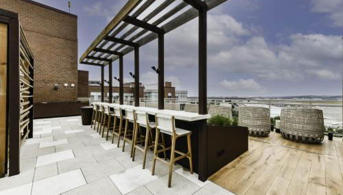 Comfy 2BR Oasis with Scenic Rooftop & Gym - Photo 3