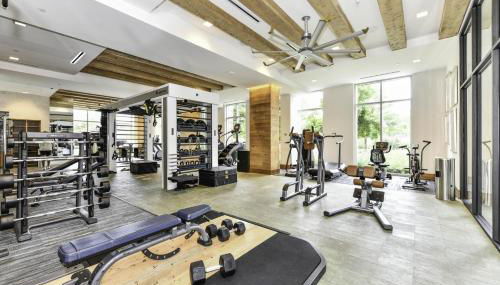 Comfy 2BR Oasis with Scenic Rooftop & Gym - Photo 4