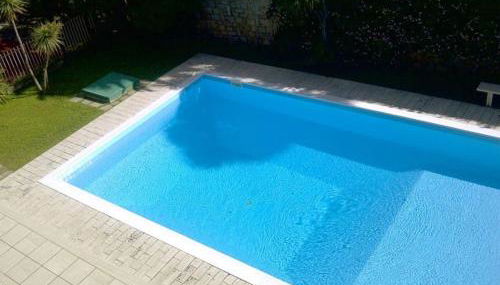 affascinante bilocale con piscina - Photo 4