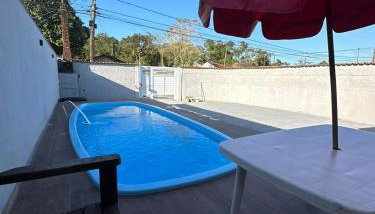 Casa com piscina em Itanhaem perto da praia - Foto 1, sunbed