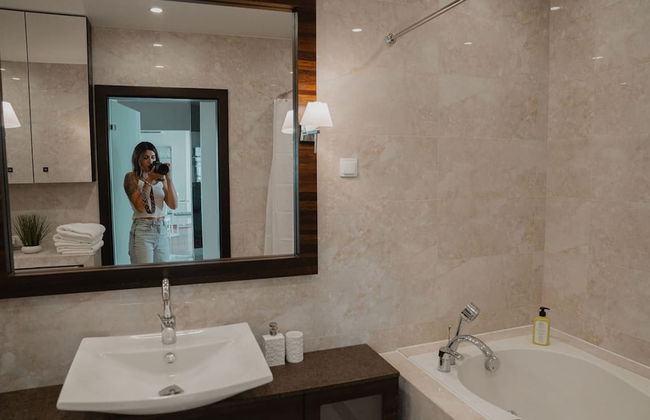 Chic Metro-side Apartment - Photo 13