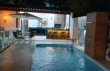 Linda casa com piscina, quiosque e churrasqueira a 150 metros da praia - Foto 20