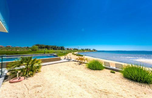 JamC Dream Familientraum direkt am Meer mit beheiztem Pool - Photo 18