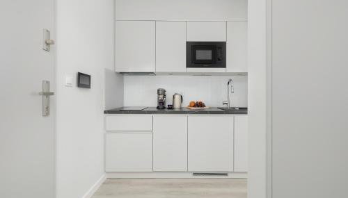 Apartment in the Centre of Zakopane Szymony by Noclegi Renters - Foto 5, stove