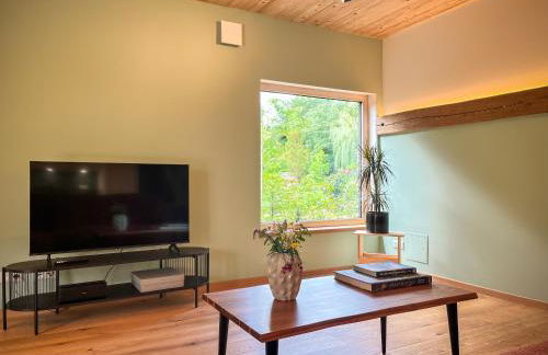 Amber Ferienhain - Ferienhaus 'Kirsche' mit verwunschenem Garten & privater Sauna - Foto 13