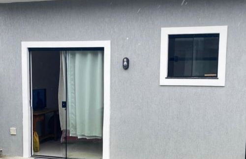 Suíte privativa aconchego a alguns passos da praia - Foto 1