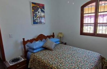 Casa Rosa de Peruíbe - Casa de Temporada 3 dormitórios, 10 hóspedes, piscina, wi-fi, netflix, 800 metros da praia - Photo 18