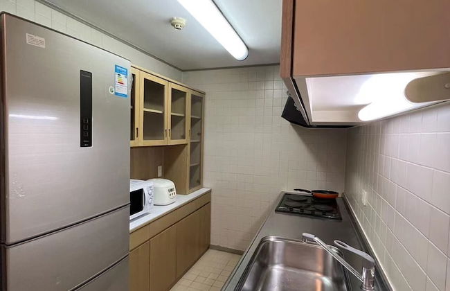 Beijing Jiuxian Apartment - Foto 10