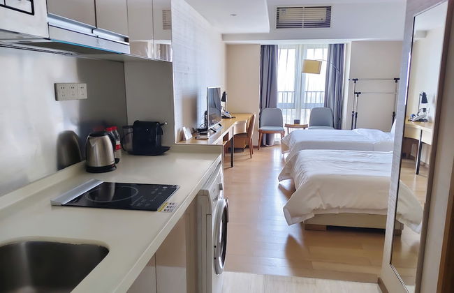 Yuwa Serviced ApartHotel - Photo 1