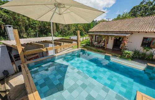 Casa Rústica com Piscina Privativa, Banheira de Hidromassagem, Ar-Condicionado, Pet friendly - Refúgio na Natureza a 5 Minutos do Centro de Imbituba, Perfeita para Famílias e Grupos - Photo 55