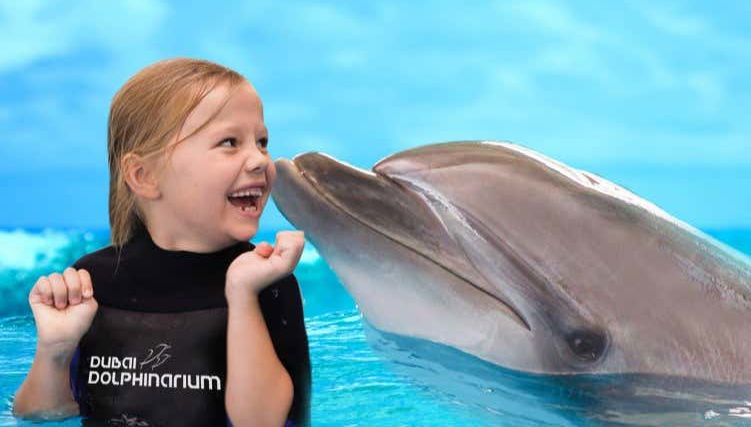 A girl having fun at the Dubai Dolphinarium