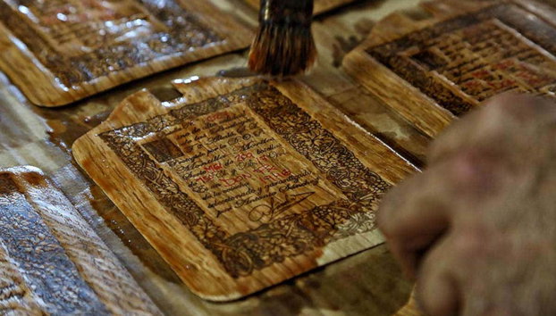 Toro Albala Winery Guided Tour - Photo 3, Varnishing Toro Albala labels