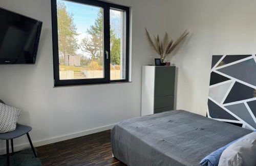 helle Ferienwohnung in Architektenhaus mit Garten und Pool - Foto 10