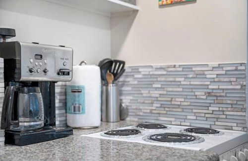 Stylish 1BR Apartment with AC Full Kitchen & WD - Just Steps to the Beach - Photo 14