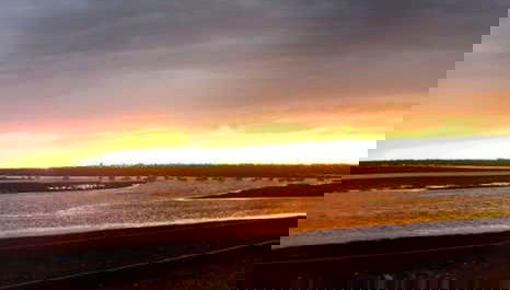 The sun setting and tinging the skies orange