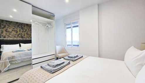 Ocean View Malagueta - Photo 5, towels, wardrobe, heating