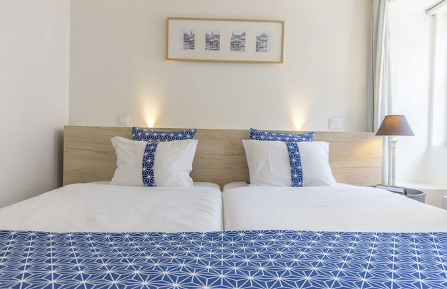 Bright 3BR Flat w/ AC in City Center by LovelyStay - Photo 17