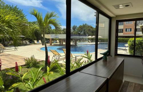 GUARAJUBA PARAÍSO DAS ÁGUAS - APT 2 quartos com AR e TV em TODOS os cômodos - Incluso Roupa de CAMA e BANHO - Filtro de Água Gelada e Maquina de Lavar dentro do APT - TOTAL CONFORTO PARA VC E SUA FAMILIA - Cond A beira da Lagoa e perto da PRAIA - Foto 2