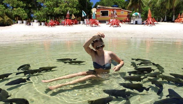 Sitting with the tambaqui fish in the lagoon