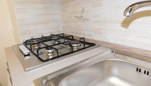 Cariteo Home - Photo 3, stove