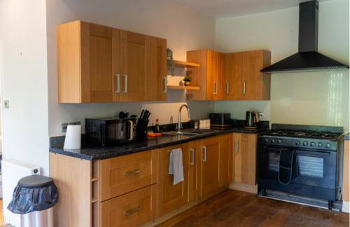 Spacious 15 Guest Home With 9 Beds in Shirley - Photo 15