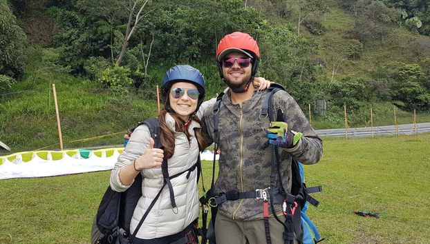 Two happy friends after their paragliding experience