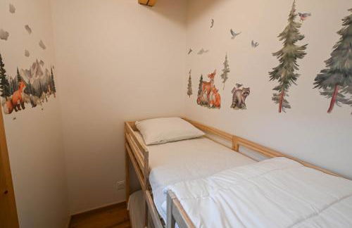 Dans résidence neuve LE SNOW ROC sur les pistes, appartement 8 personnes 2 chambres et coin montagne avec Terrasse WIFI et SAUNA - Photo 21