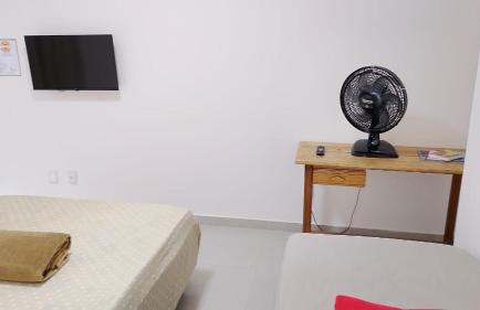 Suíte privativa aconchego a alguns passos da praia - Foto 2