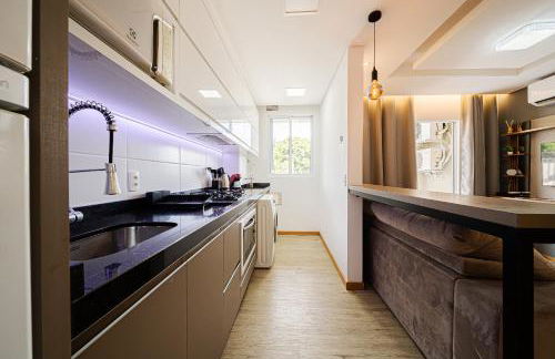 Aconchego e privacidade para sua família com 2 quartos, sala e cozinha integrados e sacada com churrasqueira - Foto 11