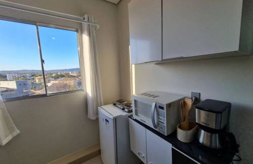 Kitnet404 central, com tv smart,linda vista para janela - Foto 4