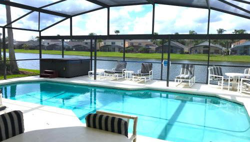 Sunny South Facing Pool with Hot Tub and Lake View Near Disney - Foto 2, sunbed