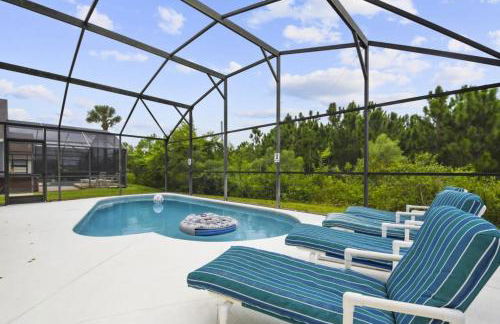 Themed 4BR house pool game room 10 min Disney - Photo 1