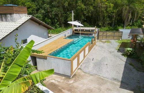 Casa Rústica com Piscina Privativa, Banheira de Hidromassagem, Ar-Condicionado, Pet friendly - Refúgio na Natureza a 5 Minutos do Centro de Imbituba, Perfeita para Famílias e Grupos - Photo 10