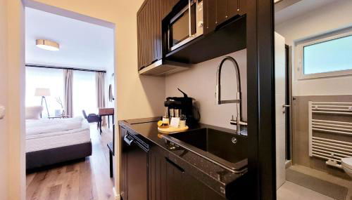 Moderne 1 Zimmer Ferienwohnung mit Sonnenterrasse und Parkplatz, in ruhiger Lage, nur wenige Gehminuten zum Ostsee Sandstrand - Foto 5