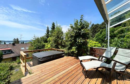 Ferienhaus Wellnesshütte mit Außenwhirlpool und herrlichem See-und Alpenblick - Foto 2