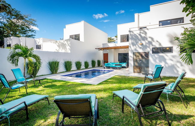 Ultramodern Townhome with an Inviting Coastal Design and Lush Outdoor Oasis with a Private Pool - Photo 24