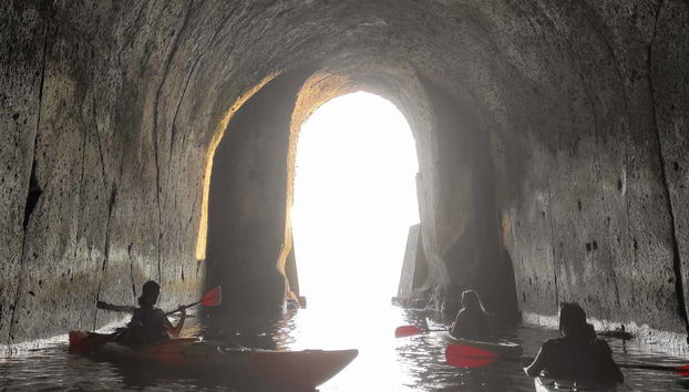 Emerging from a cave