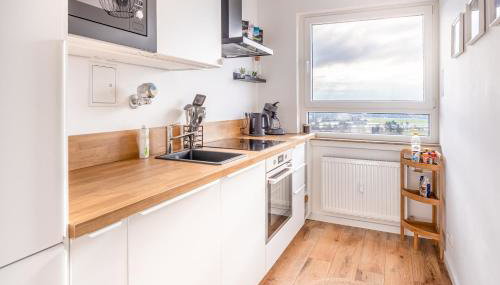 Moderne 2-Zimmer-Wohnung mit atemberaubender Skyline Aussicht auf Frankfurt! - Foto 4, stove