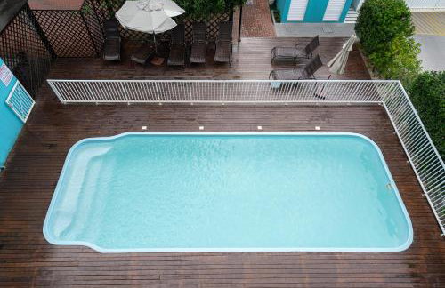 Apto em Barra Velha 340m da PRAIA com SACADA com CHURRASQUEIRA, AR CONDICIONADO WI-FI, PISCINA, PORTARIA 24h, ACADEMIA MINI MERCADO e vaga de GARAGEM - Photo 7