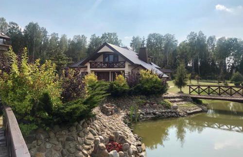 Dom nad stawem przy lesie - Foto 15