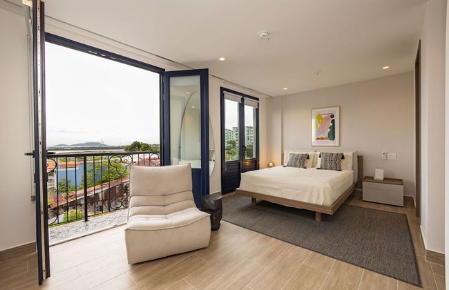 The Acapella Condo by Acomodo - Photo 1