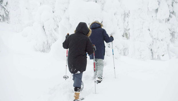 With the snow shoes