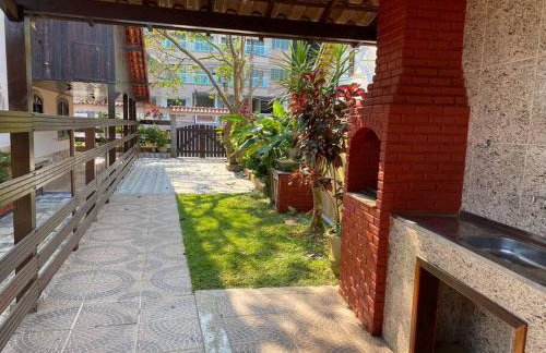 Ampla casa em condomínio a 300mt da praia - Foto 6