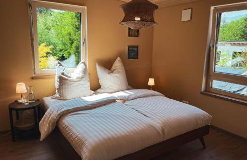 Amber Ferienhain - Ferienhaus 'Magnolie' mit verwunschenem Garten & privater Sauna - Foto 10