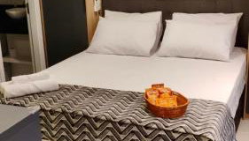 Studio Luxuoso Cama Queen Ar Condicionado e Cozinha Completa - Foto 5