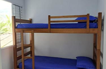 Casa nova com 3 quartos, equipada com Ar Condicionado, TV, Internet e Área de Lazer Completa - Boiçucanga - Foto 7