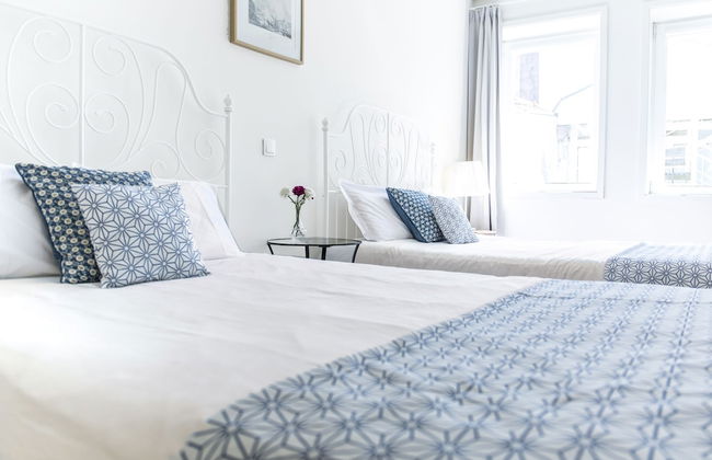 Bright 3BR Flat w/ AC in City Center by LovelyStay - Photo 9