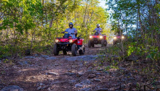 Crossing various dirt tracks on a quad bike