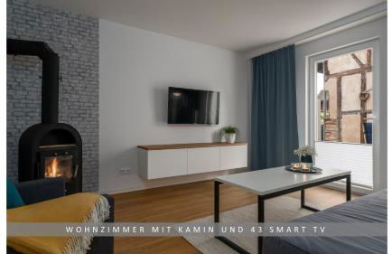 Apartment Leinetal mit Kamin & Kaminholz, 1-3 Personen , Schlafzimmer mit Boxspringbett 180x200 & hochwertige Hotelbettwäsche, bequemes Einzelbett im Wohnzimmer, Terrasse, Einbauküche, - Photo 6